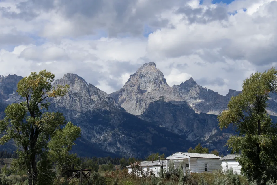 The Teton range rising over an open landscape